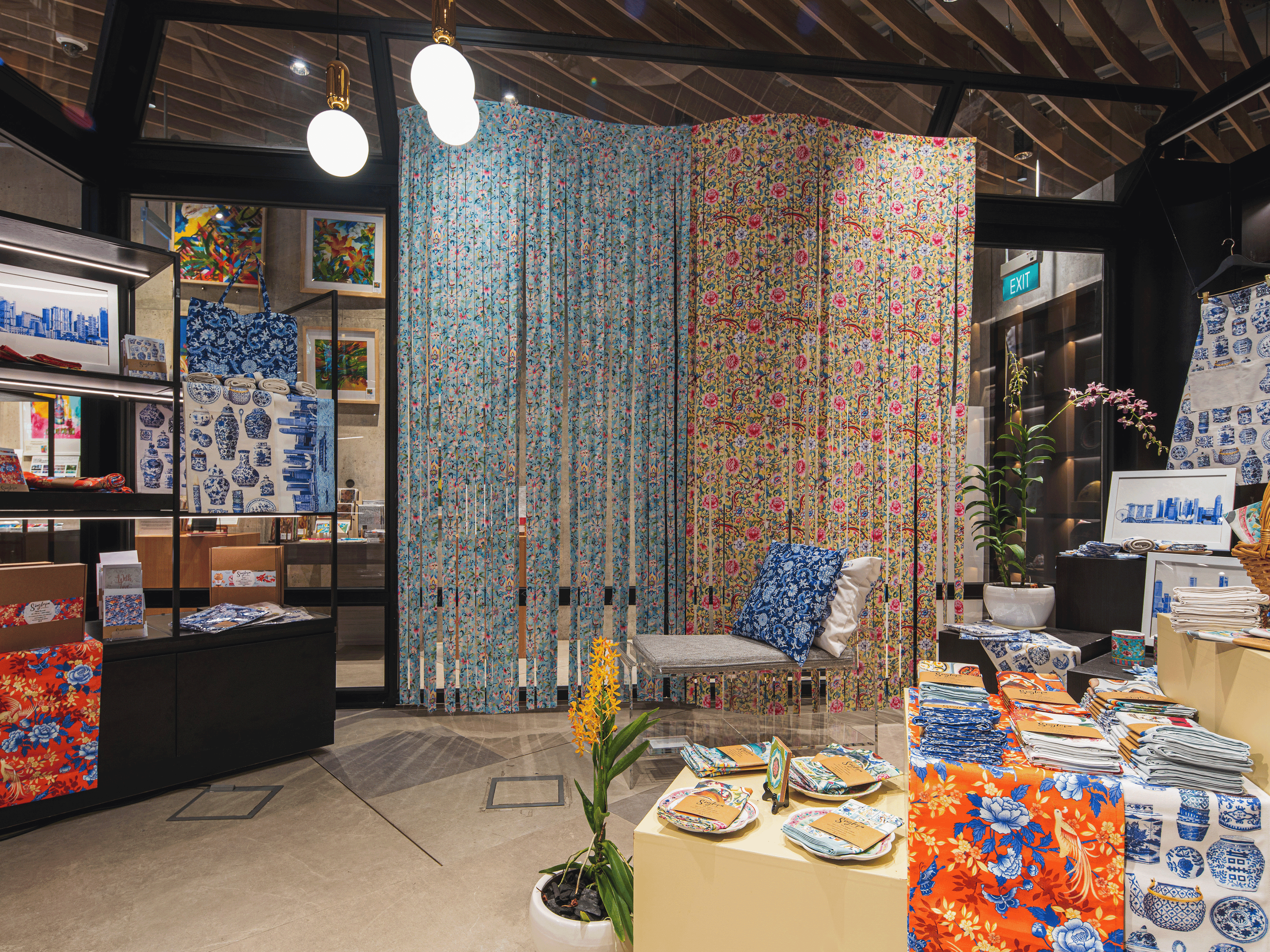 Decorative fabric panels and tableware display in a store setting