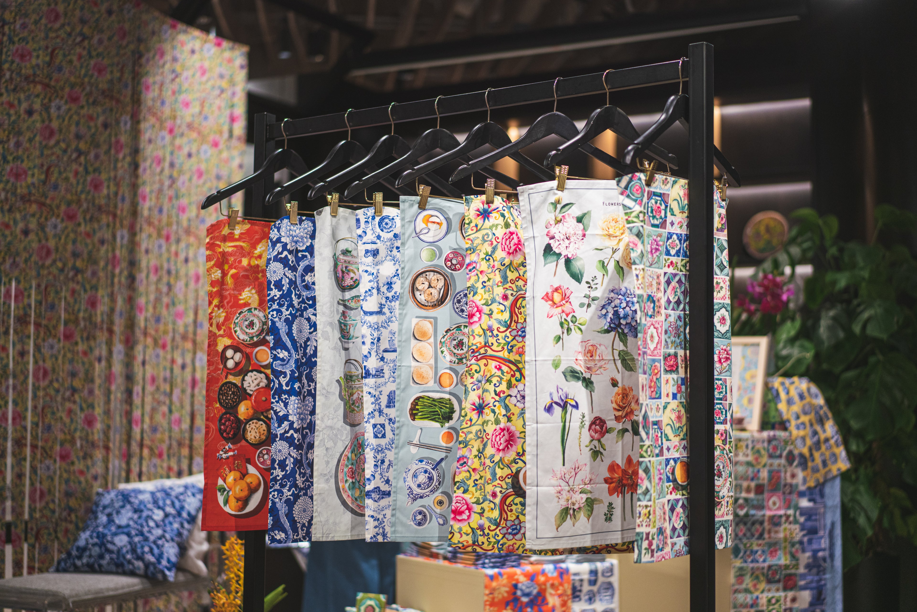 Hangers with Artistic tea towels on a rack