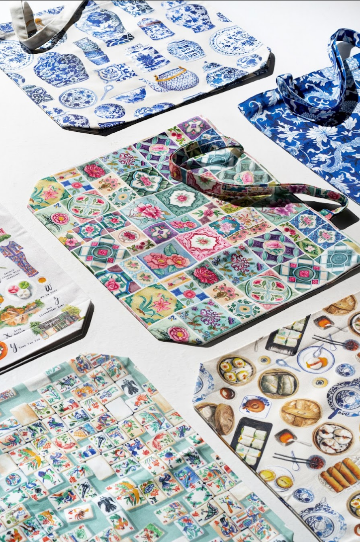 Collection of patterned tote bags on a white surface
