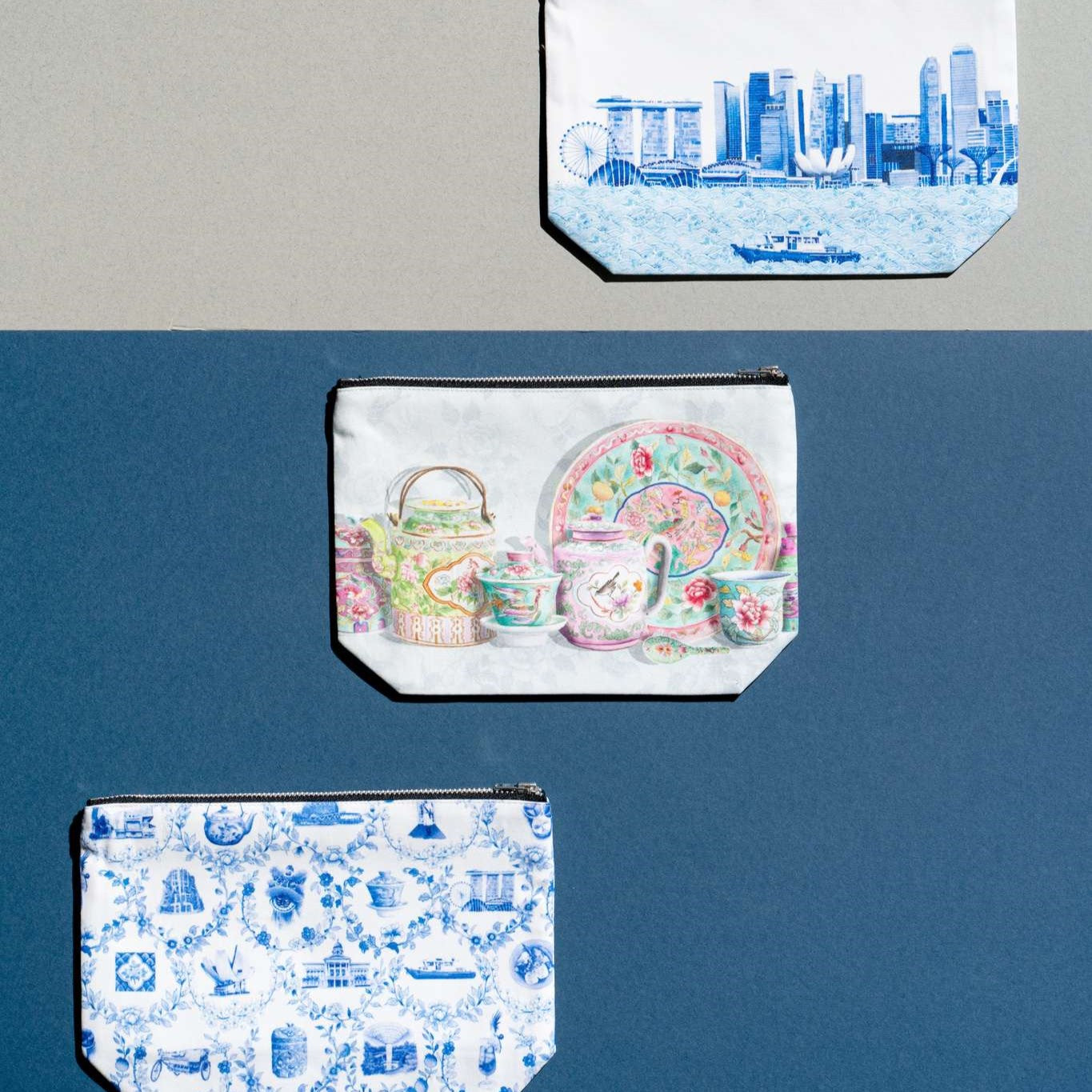 Pouches with zips on a grey and blue background