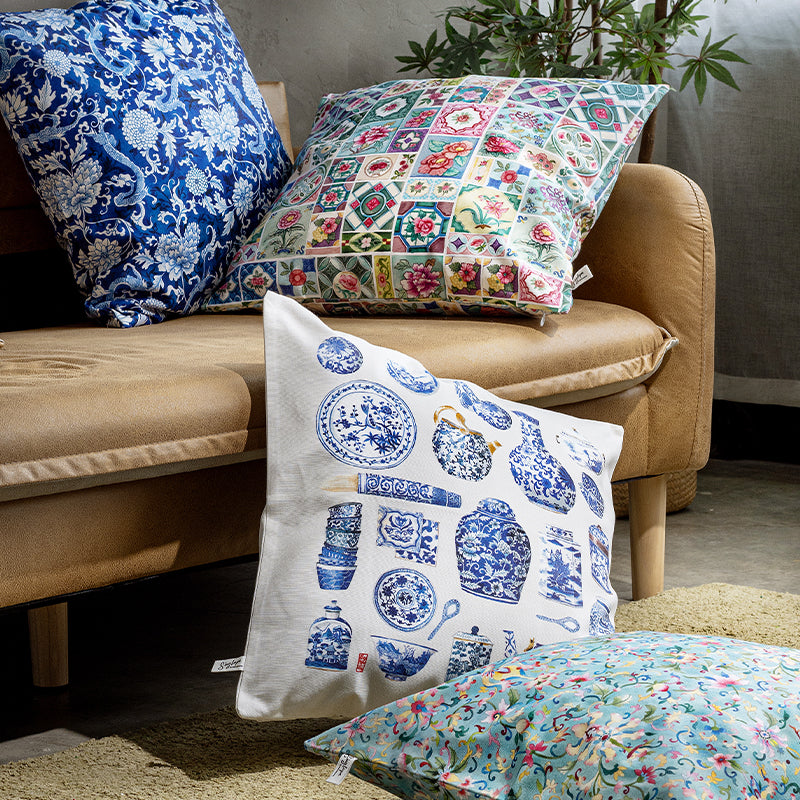 Lifestyle image of cushion covers on a couhc and grey background.