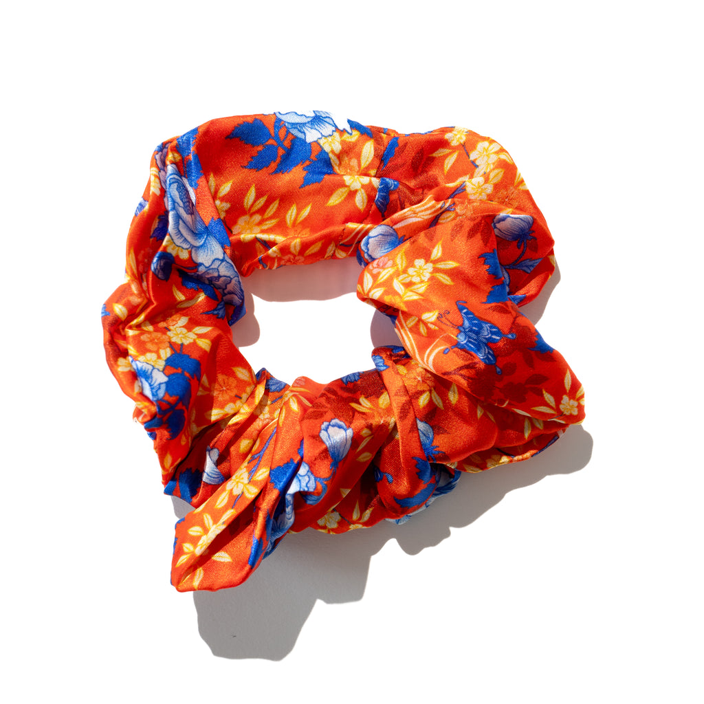 Singlapa multicolored floral silk scrunchie with butterflies displayed on a white background.