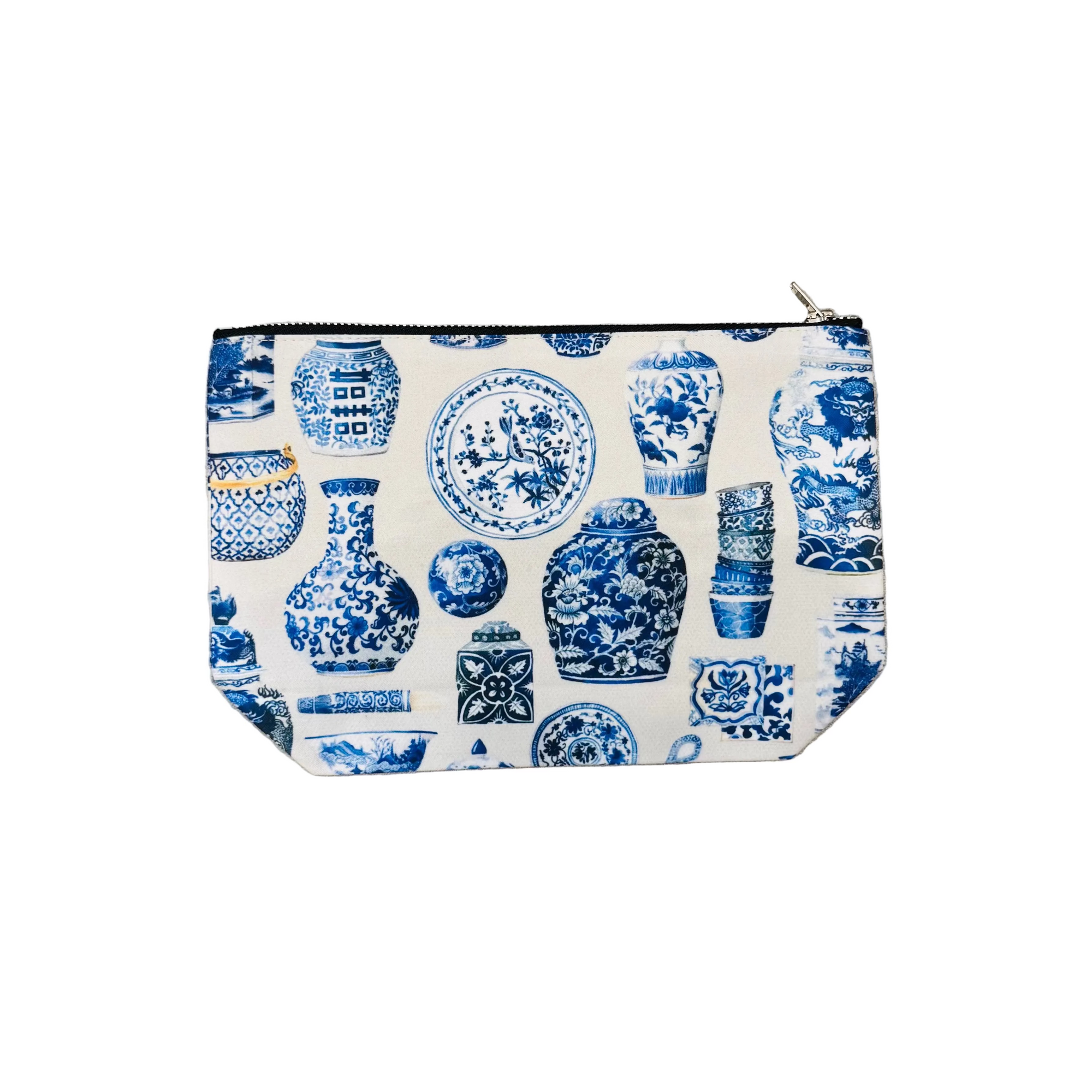 Pouch with blue and white ceramic pattern on a light gray floor