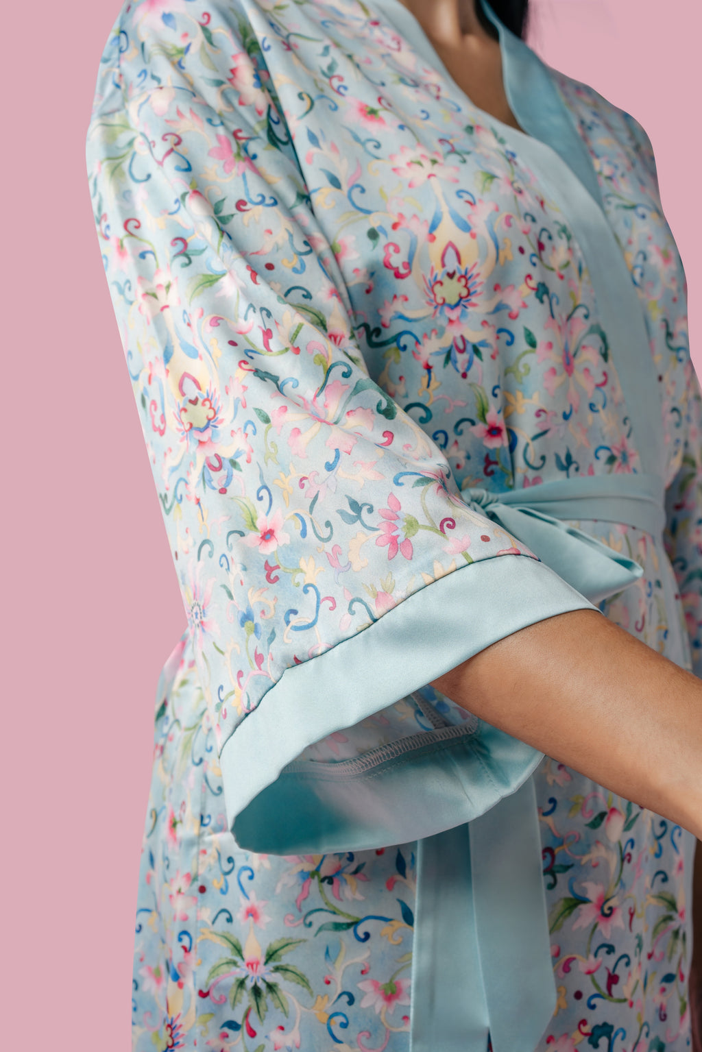 Closeup of a woman wearing a blue floral patterned kimono