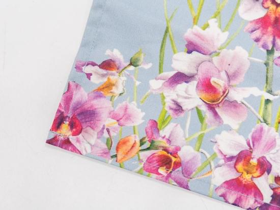 Closeup image of napkin with singapore's national flower