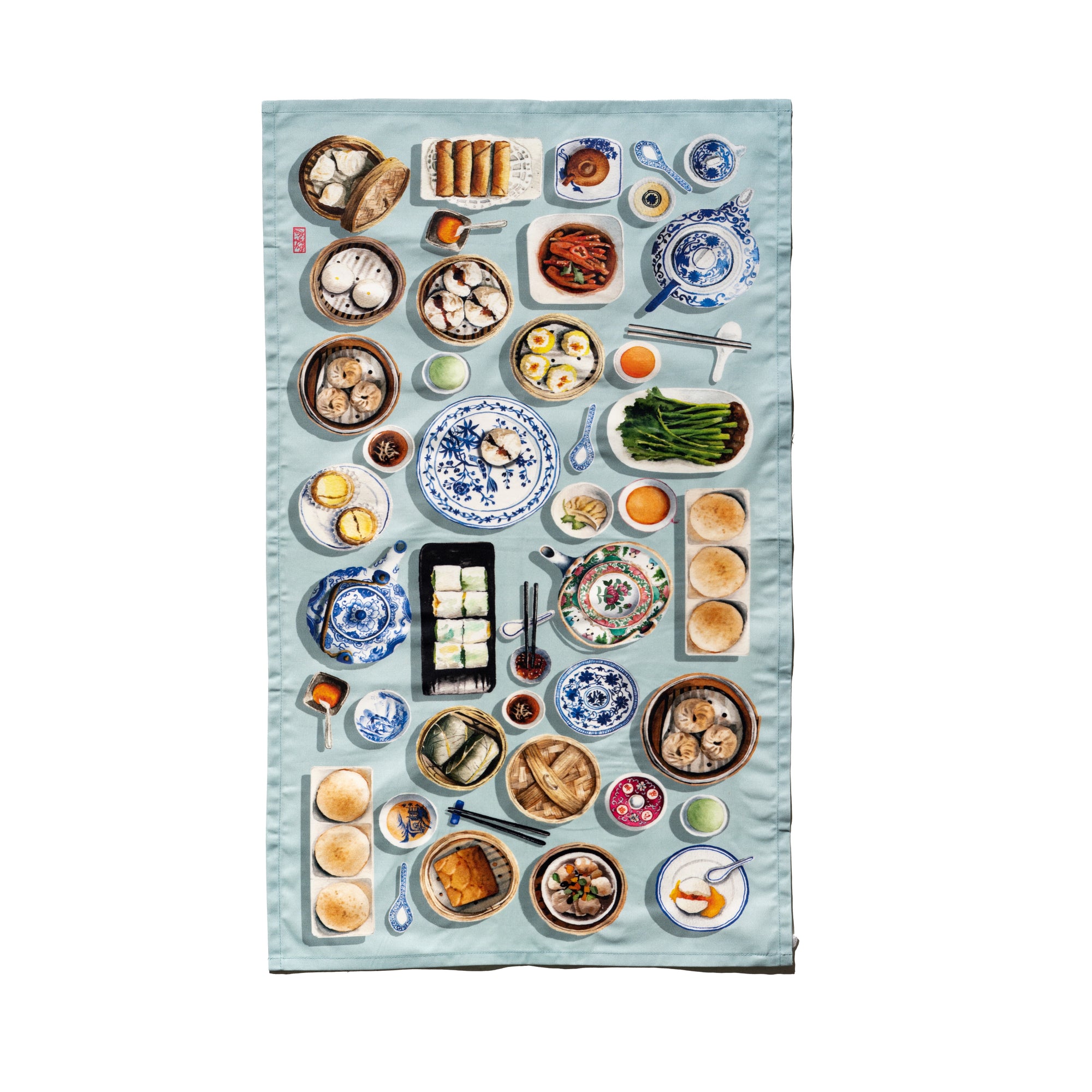Singlapa Tea towel with a variety of tea-time treats and tea sets on a light blue background