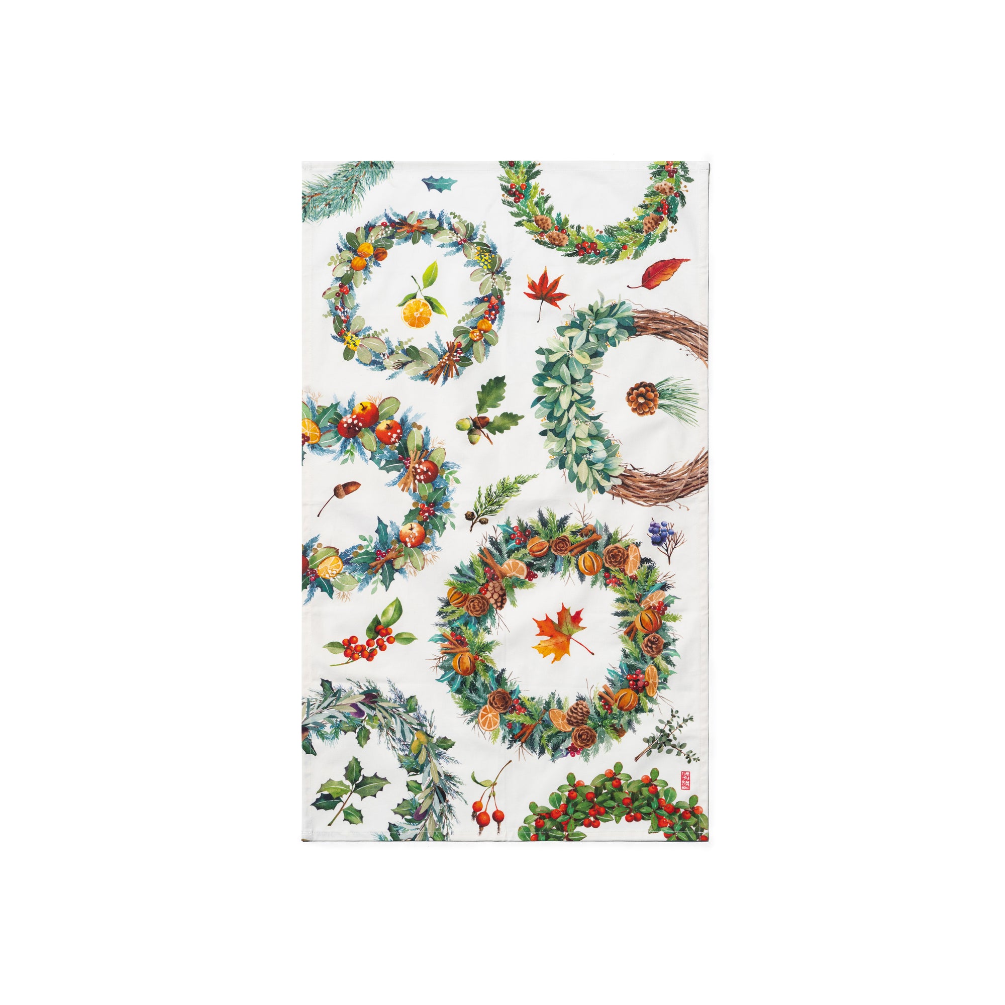 Singlapa tea towel with a Christmas wreath design featuring various circular patterns of greenery, berries, and decorative elements.