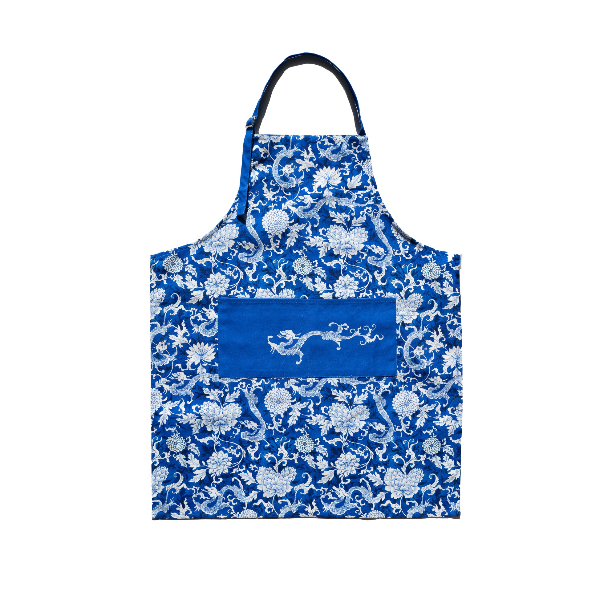 A blue apron with a floral and dragon pattern and a larger depiction of a dragon in the center.