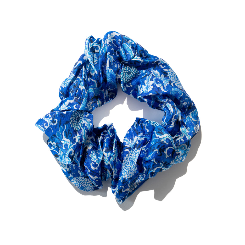 Singlapa blue silk scrunchie with white floral and dragon design.