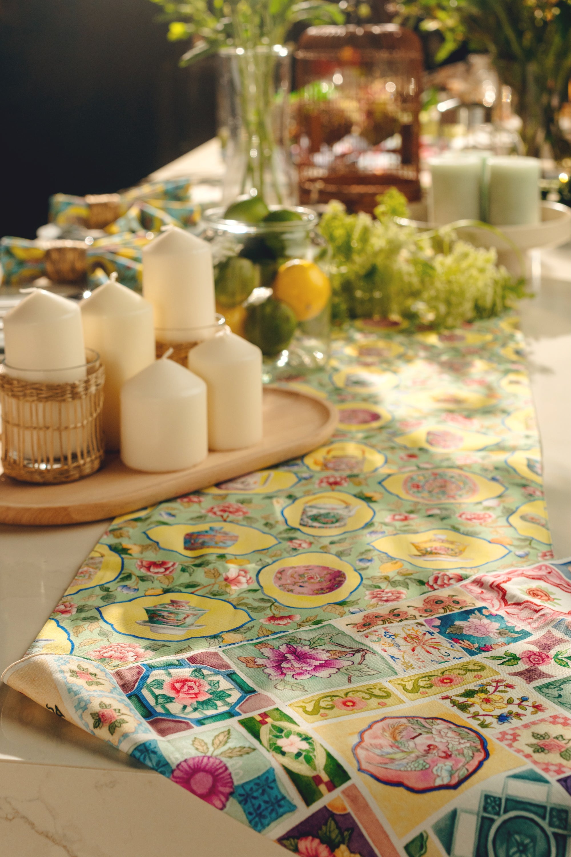 Colorful table runner with floral patterns on a table setting.