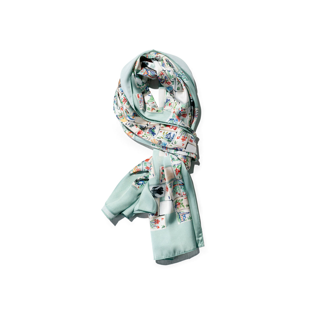 Singlapa silk scarf with a floral and geometric pattern, primarily in light blue shades.