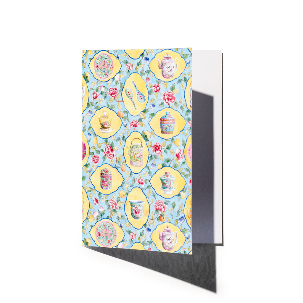 Singlapa greeting card with a watercolor floral pattern featuring teapots and yellow frames in a white background.