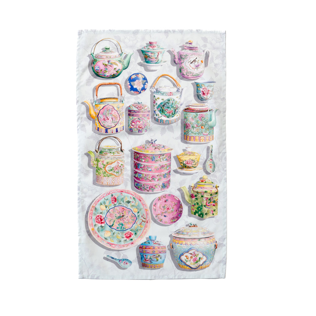 Singlapa tea towel with a mix of colourful porcelain teapots and cups on a grey background.