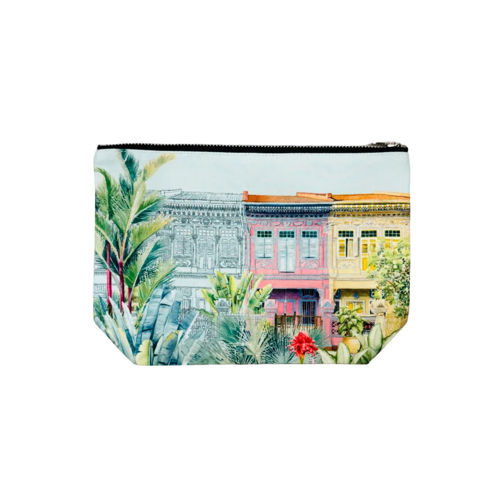 Pouch with a colorful street scene design on a white surface