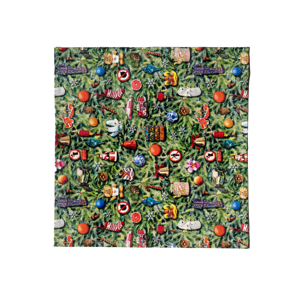 Colorful patterned fabric with various shapes and designs on a green background