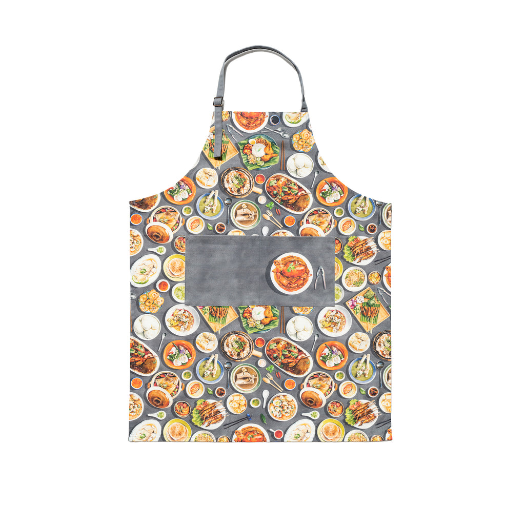 Singlapa multicolored apron featuring a pattern of various Singaporean hawker foods such as chili crab, bak chor mee, and chicken rice.