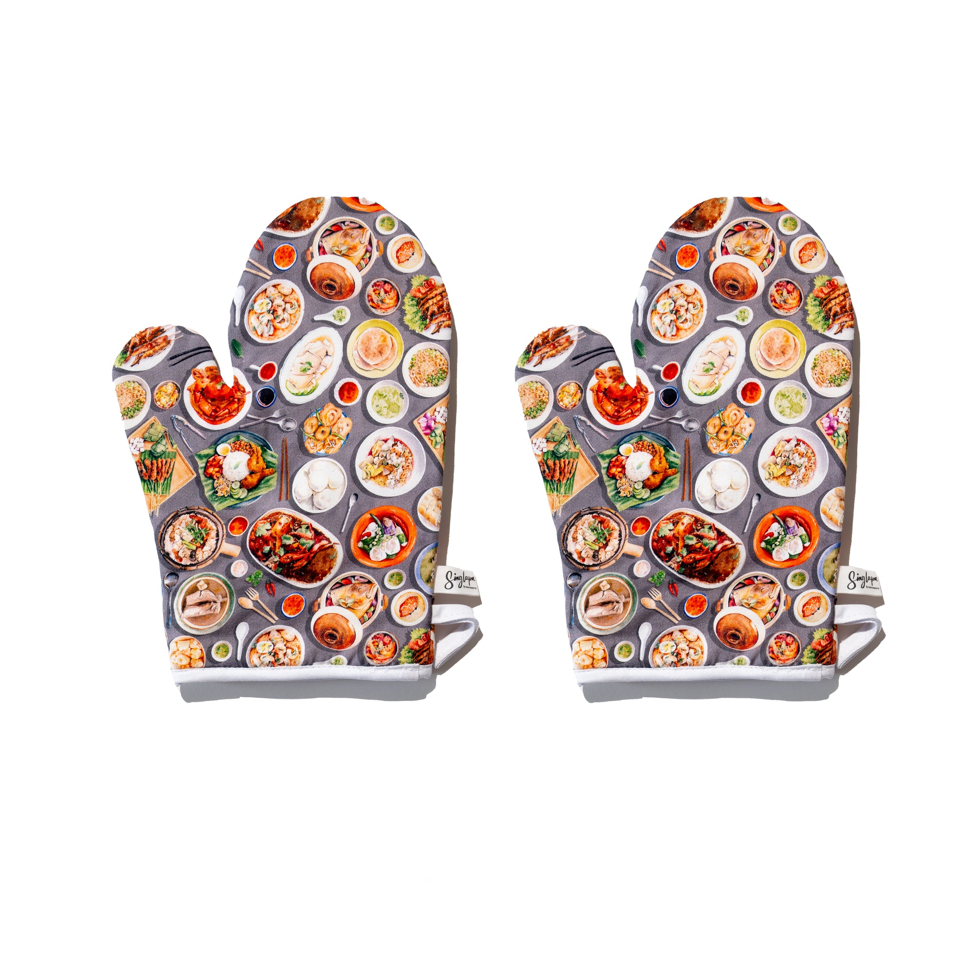 Singlapa oven mitts with a colorful design featuring various Singaporean hawker foods such as chicken rice, chilli crab, and bak chor mee.