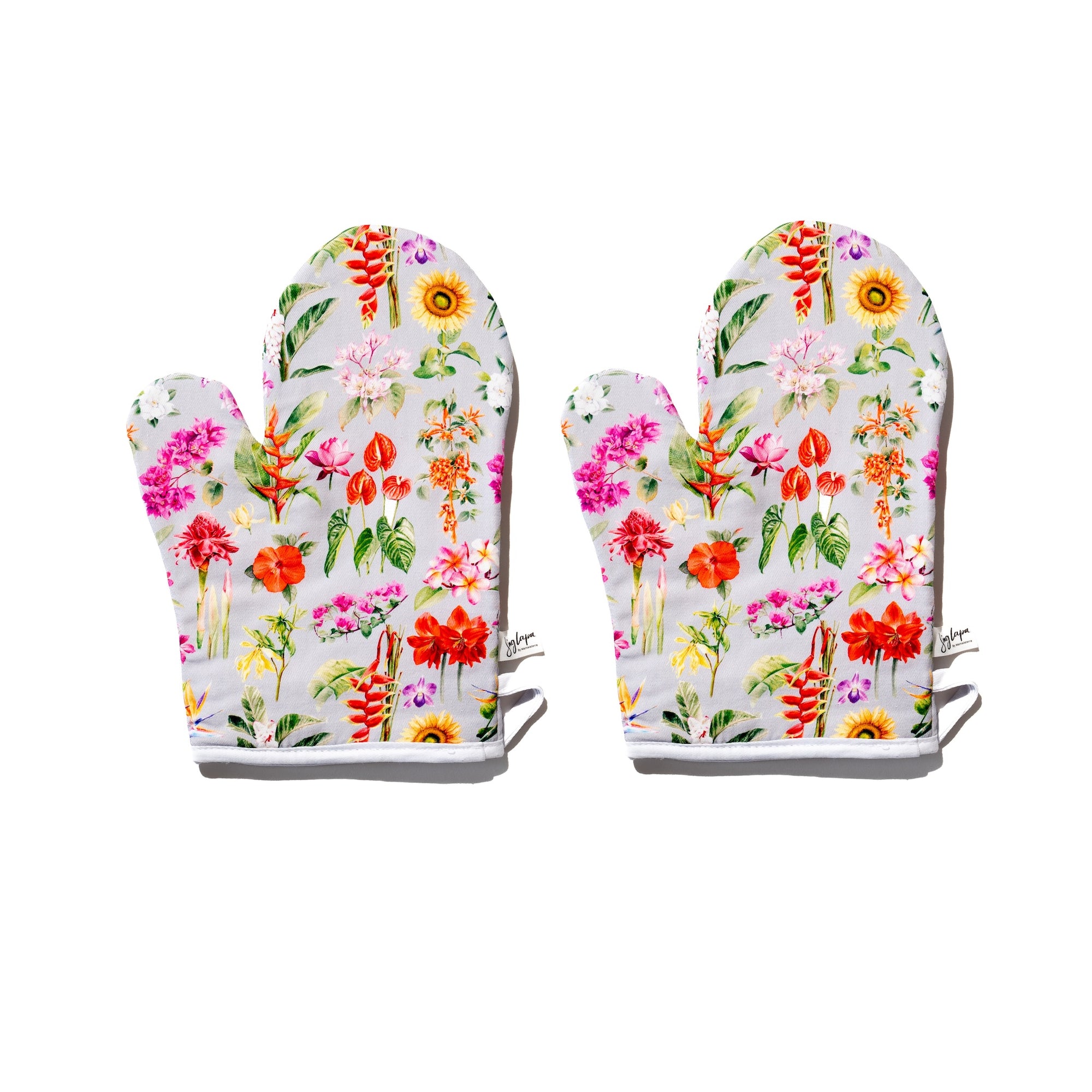 Singlapa oven mitts with a tropical flower design, featuring patterns of bougainvillea, hibiscus, and bird of paradise.