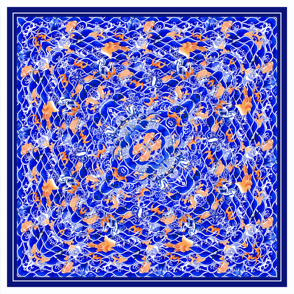 Decorative scarf with a blue wave and orange fish pattern on a white background