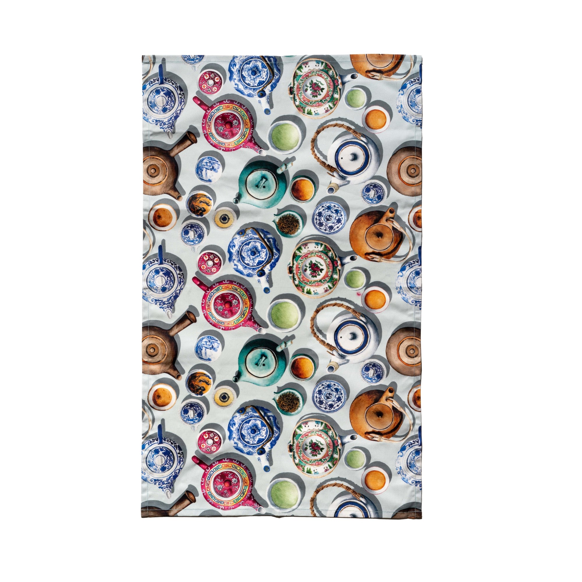 Singlapa kitchen towel featuring a detailed and vibrant pattern of Chinese teapots and related accessories on a light background.