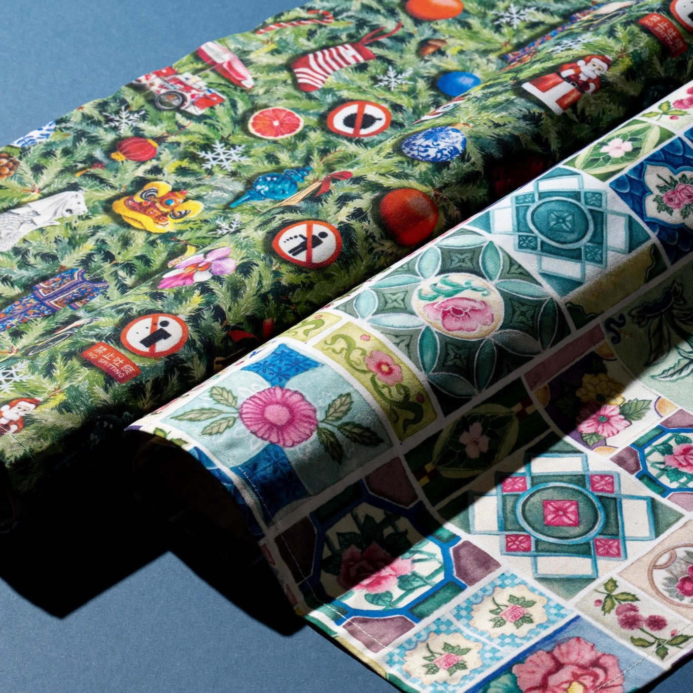 Lifestyle image of napkins =placed side by side on a dark blue background