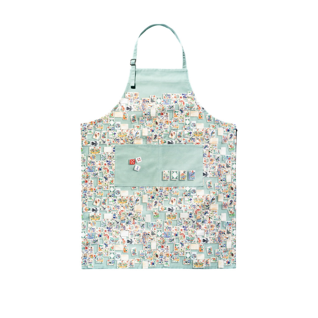A apron with a multicolored floral and geometric pattern of mahjong tiles, featuring front pockets and an adjustable neck string.