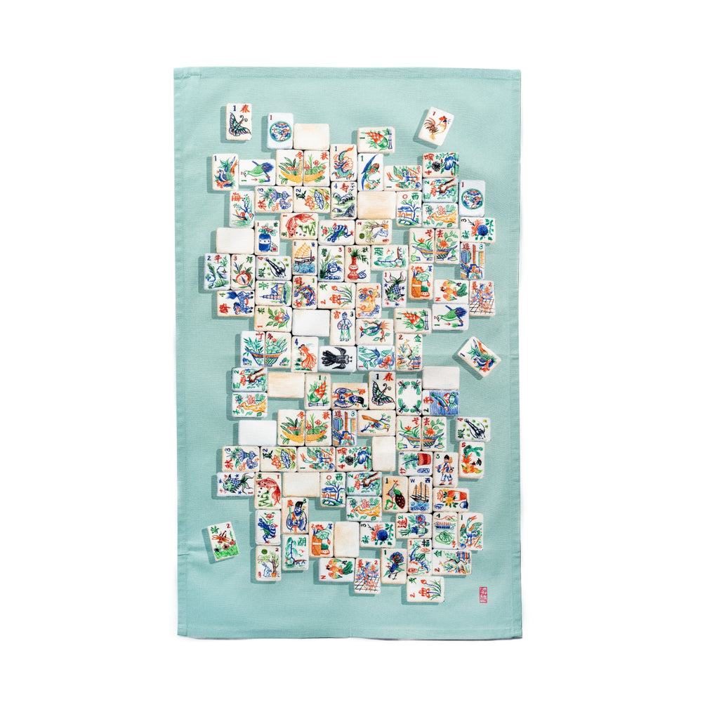 Singlapa tea towel featuring classic Mahjong tiles stacked on a blue teal background 